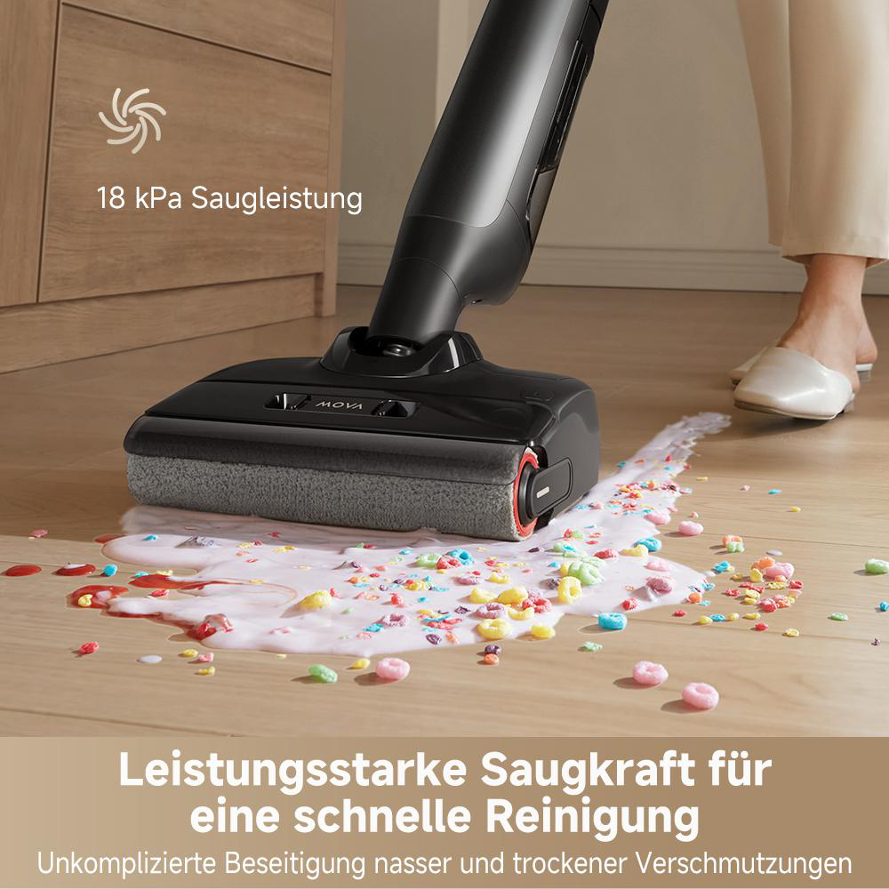 Ein Staubsauger reinigt eine Verschüttung mit bunten Partikeln.