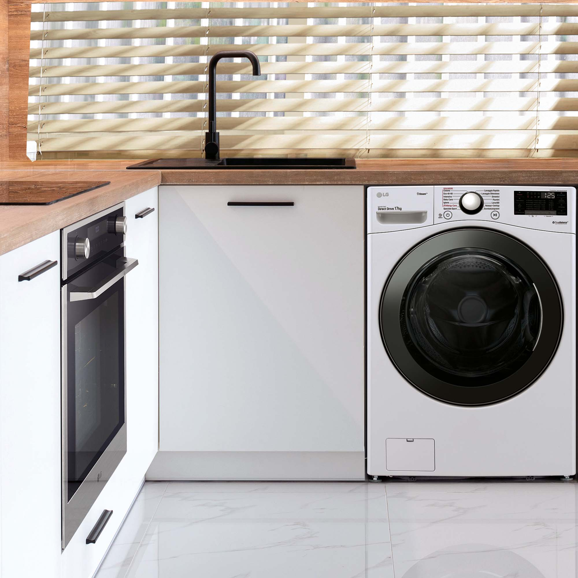Una cocina moderna con gabinetes blancos, fregadero y grifo negros, y una lavadora.