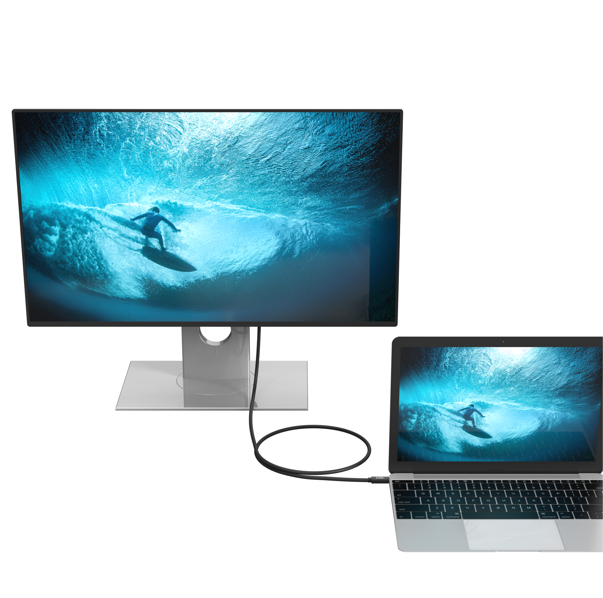 Monitor wyświetla surfera na fali, podłączony do laptopa pokazującego ten sam obraz.