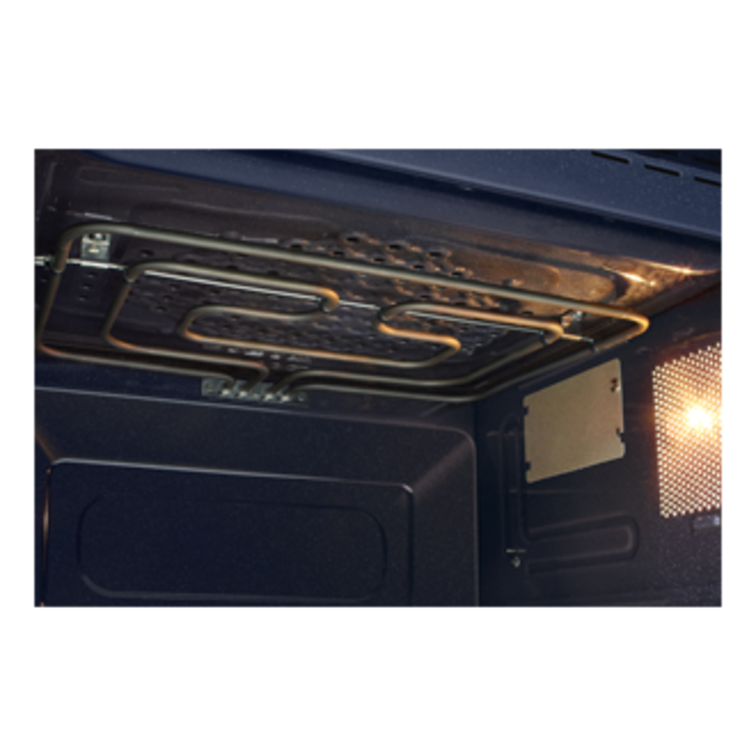 Inside a microwave. A heating element is in the top. It is dark blue inside.