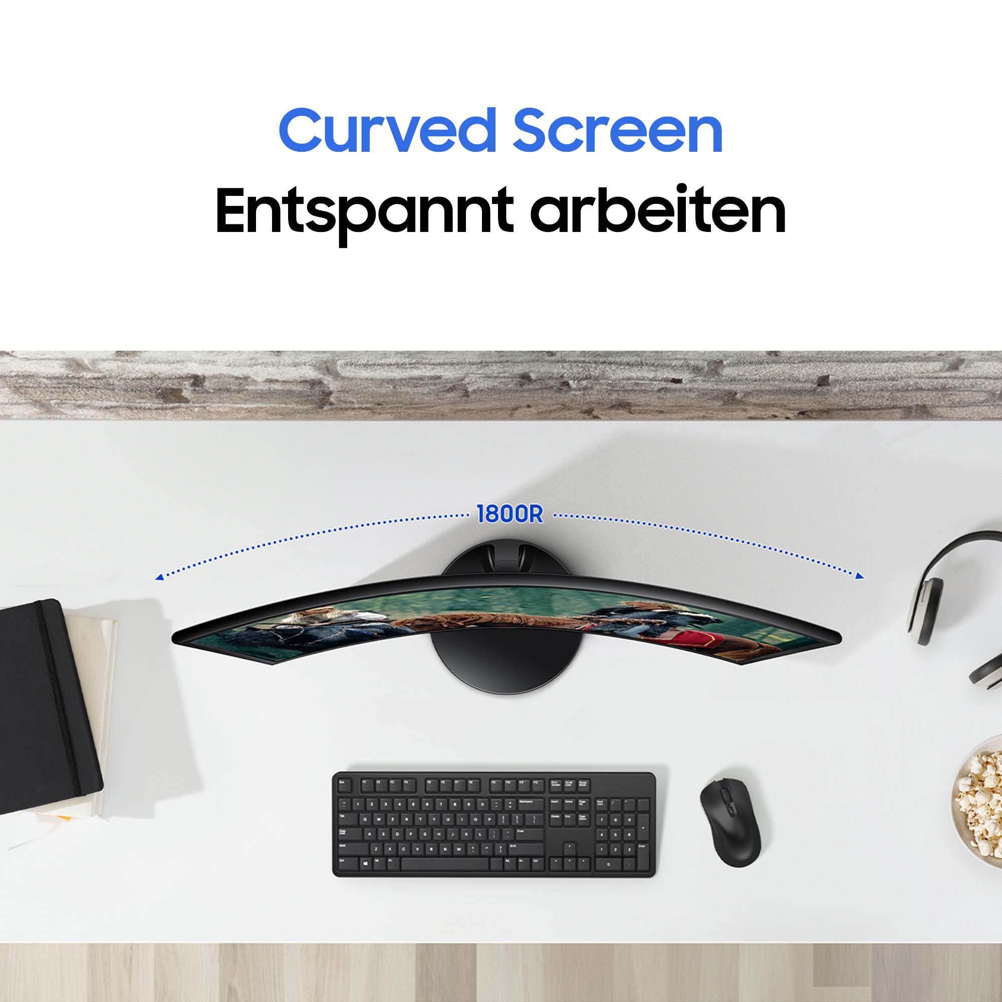 Ein gebogener Computermonitor auf einem weißen Schreibtisch mit Tastatur, Maus und anderen Artikeln.