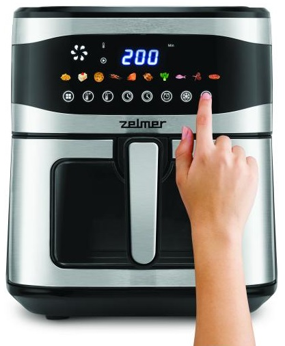 Frytkownica beztłuszczowa z dłonią dotykającą ekranu dotykowego.