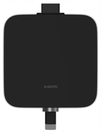 Czarne kwadratowe urządzenie z logo Xiaomi, srebrne krawędzie. Port USB-C na dole.