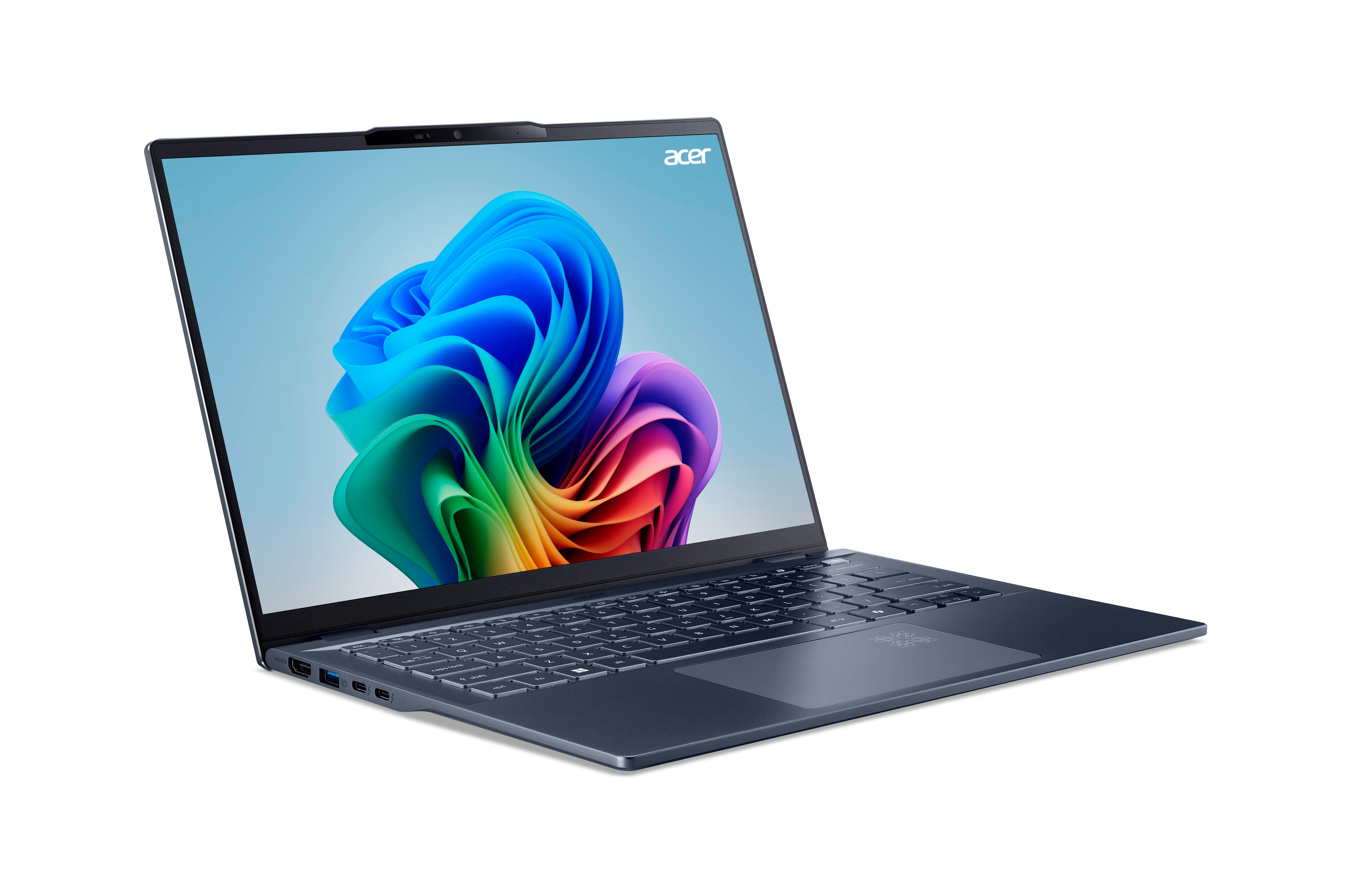 Laptop mit blauem Gehäuse und farbenfrohem Bildschirm. Der Bildschirm zeigt eine regenbogenartige Illustration.