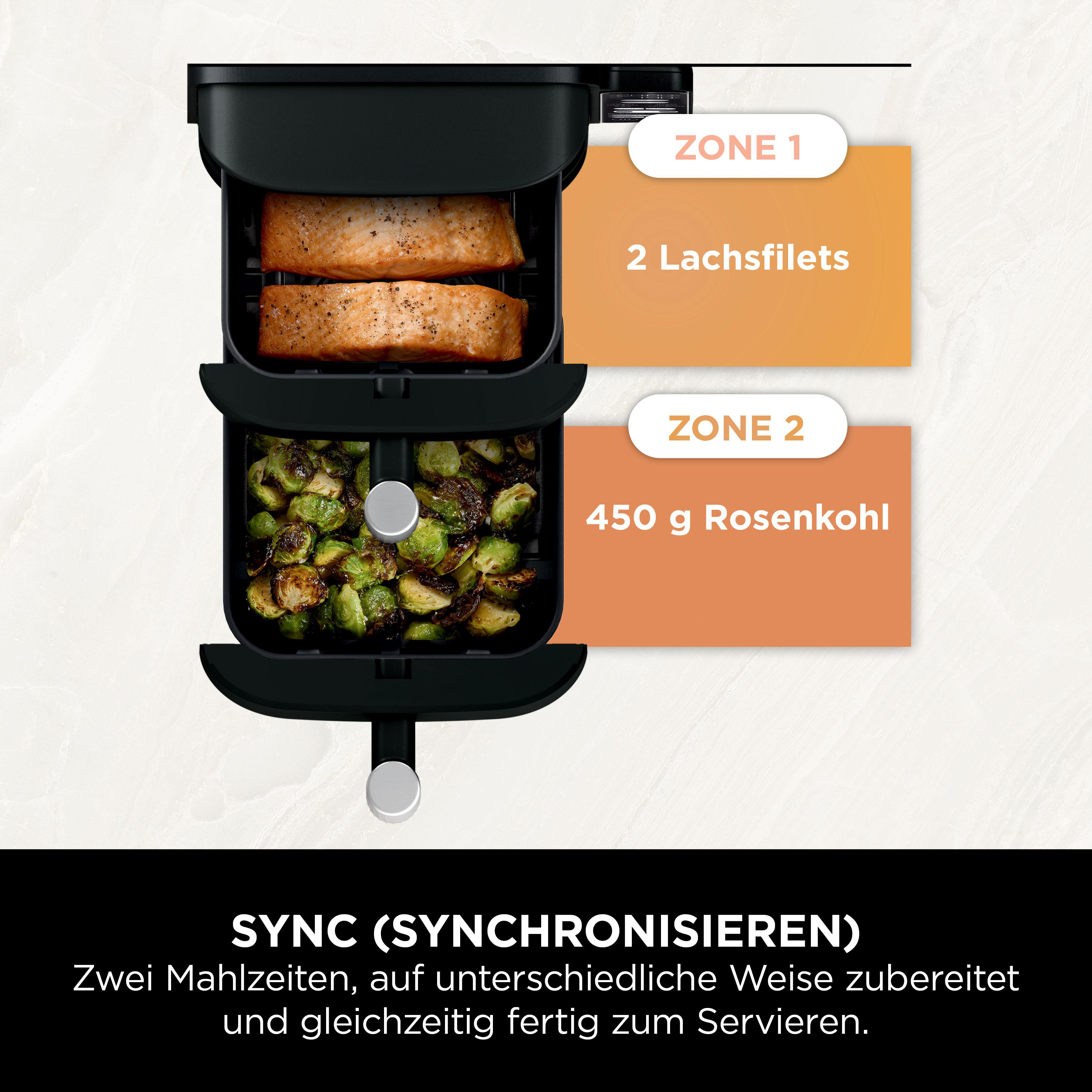 Heißluftfritteuse mit zwei Fächern, eines mit Lachs, das andere mit Rosenkohl.