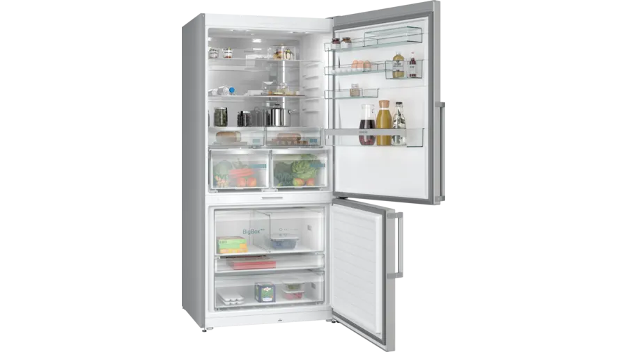Kapısı açık, yiyecek dolu rafları gösteren beyaz bir buzdolabı.