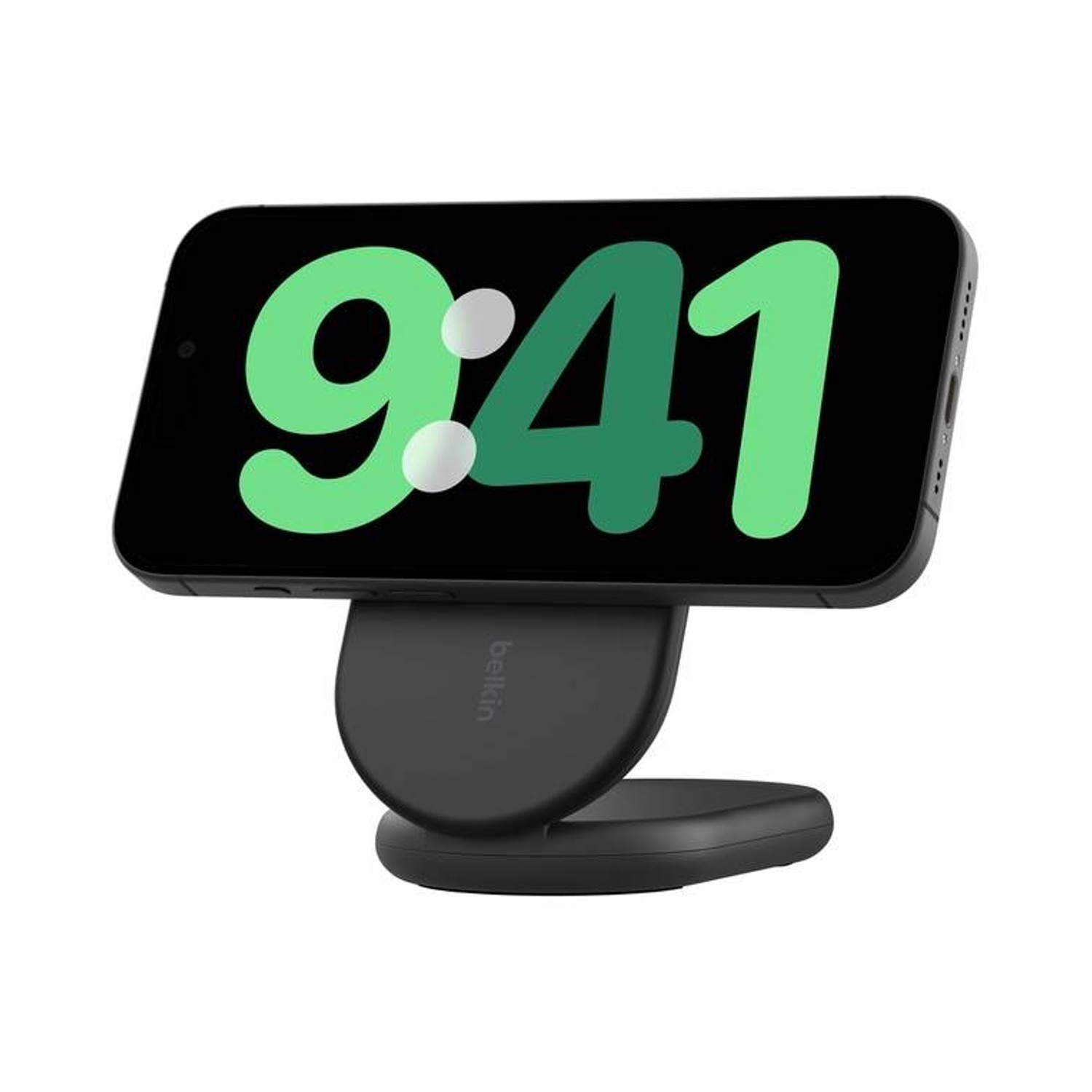 Telefono nero con l'ora 9:41 su un caricatore wireless nero.