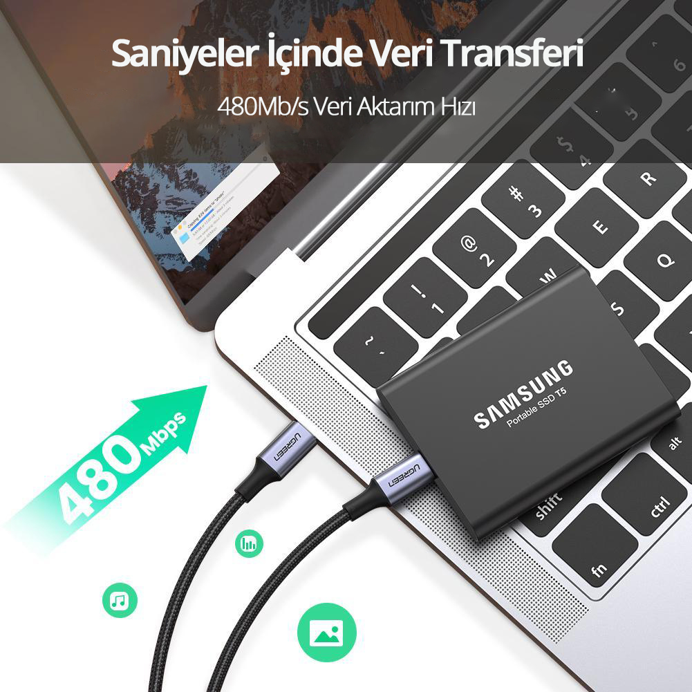 SSD, USB-C kablosu ve veri aktarımı gösteren dizüstü bilgisayar.