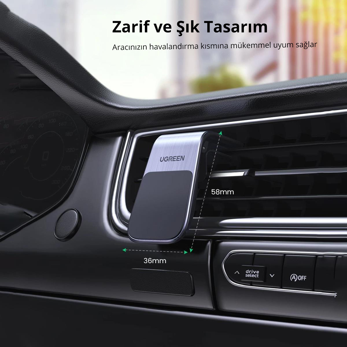 Araba hava ızgarası telefon tutucu. Gümüş ve siyah, Türkçe metinli. Bir arabaya monte edilmiş.