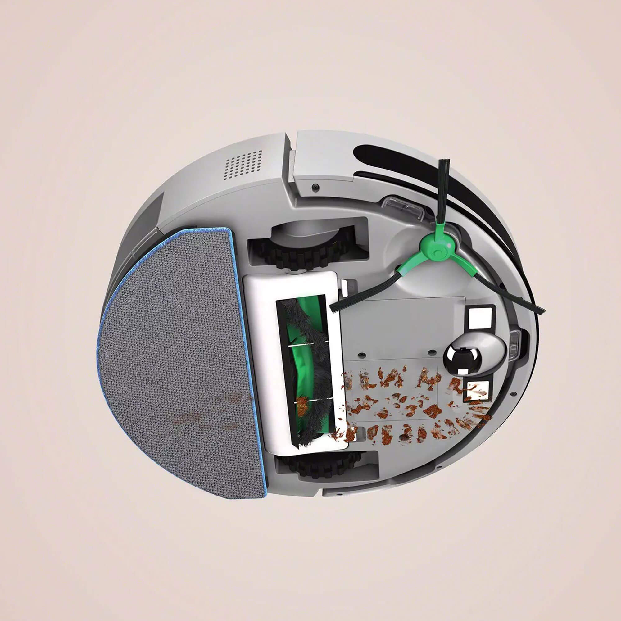 Robot odkurzający, widok przekrojowy pokazujący jego wewnętrzne komponenty i brud.