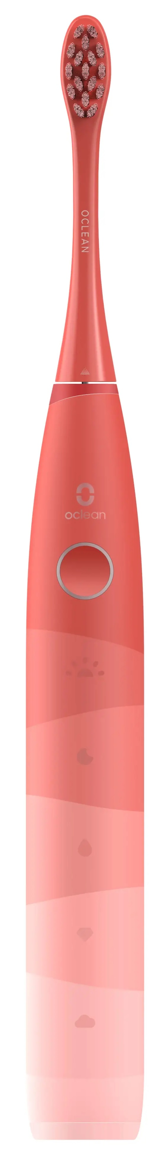 Różowa elektryczna szczoteczka do zębów. Ma okrągły przycisk i nadrukowaną nazwę marki.