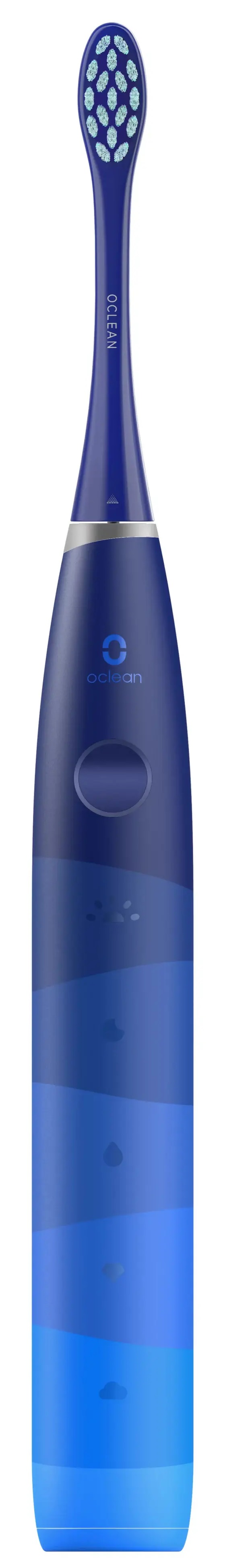 Niebieska szczoteczka elektryczna. Główka biała z niebieskim włosiem. Uchwyt w odcieniach niebieskiego.