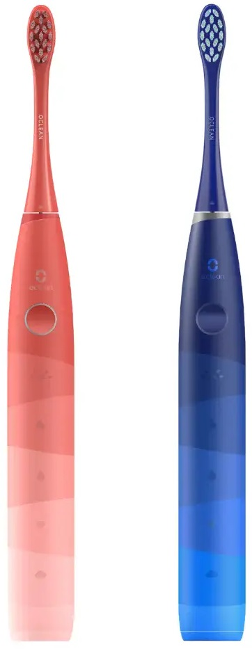 Dwie elektryczne szczoteczki do zębów, jedna różowa i jedna niebieska, na białym tle. Różne kolory.