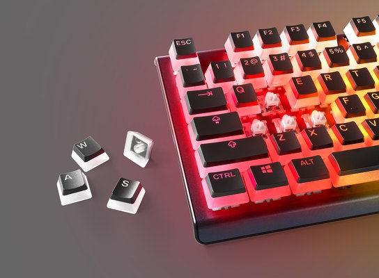 Mechanikus billentyűzet közelképe eltávolított billentyűsapkákkal és piros háttérvilágítással.