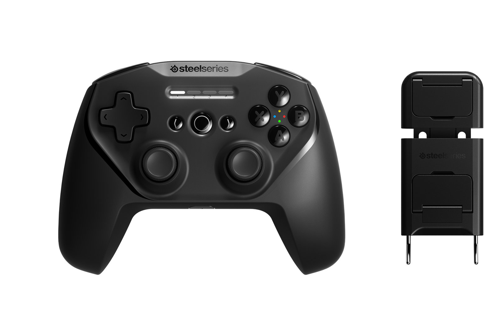 Egy fekete gamepad töltővel. A gamepad gombokkal és joystickokkal rendelkezik.