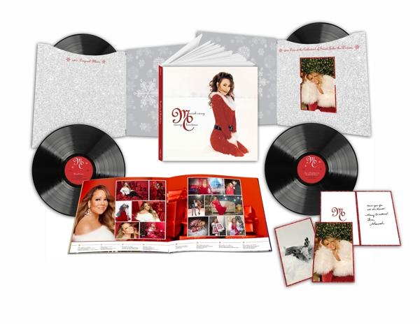 Mariah Carey Weihnachtsalbum-Set. Albumcover, Schallplatten, Karten und Einlagen. Weißer Hintergrund.