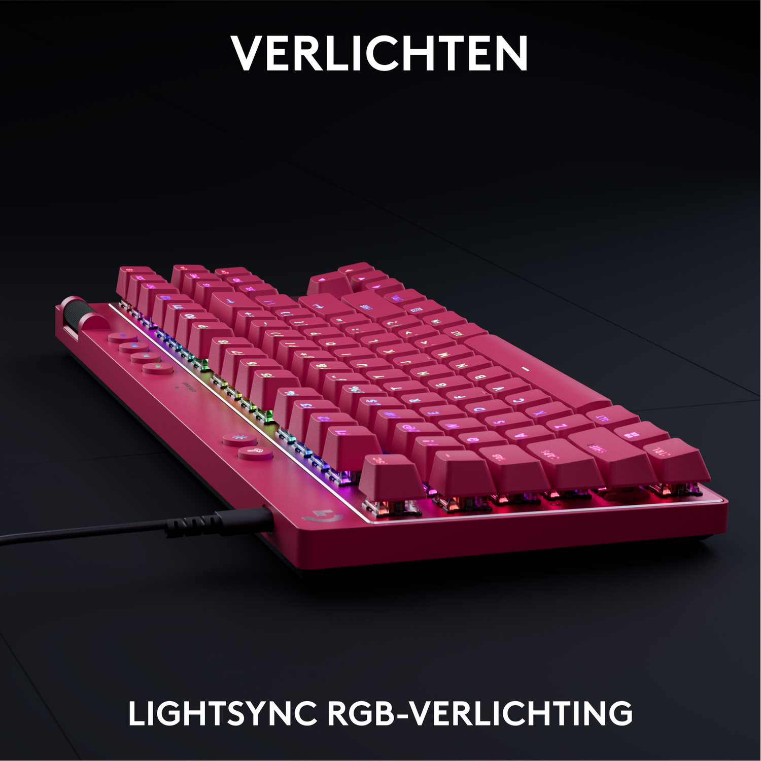 Red mechanical keyboard with illuminated keys, black surface, and lightsync RGB.