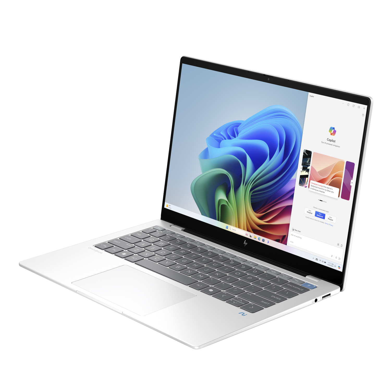 Ordinateur portable argenté avec écran ouvert affichant un bureau coloré et une fenêtre latérale.