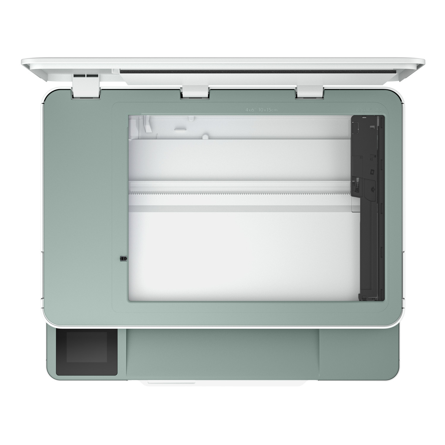 Vue aérienne d'un scanner vert clair avec le couvercle ouvert. Intérieur blanc.