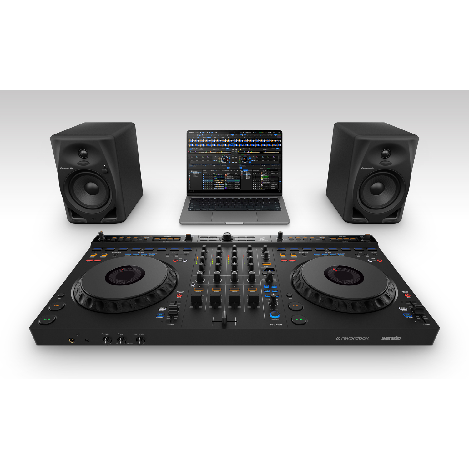 DJ setup: black mixer, speakers, and laptop. Serato DJ Pro software visible on the laptop screen.