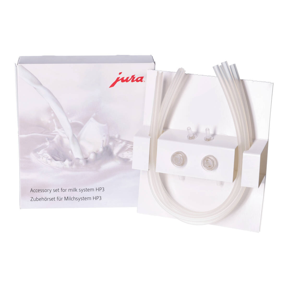 Zestaw akcesoriów do systemu mlecznego Jura, z rurkami i białym pudełkiem.