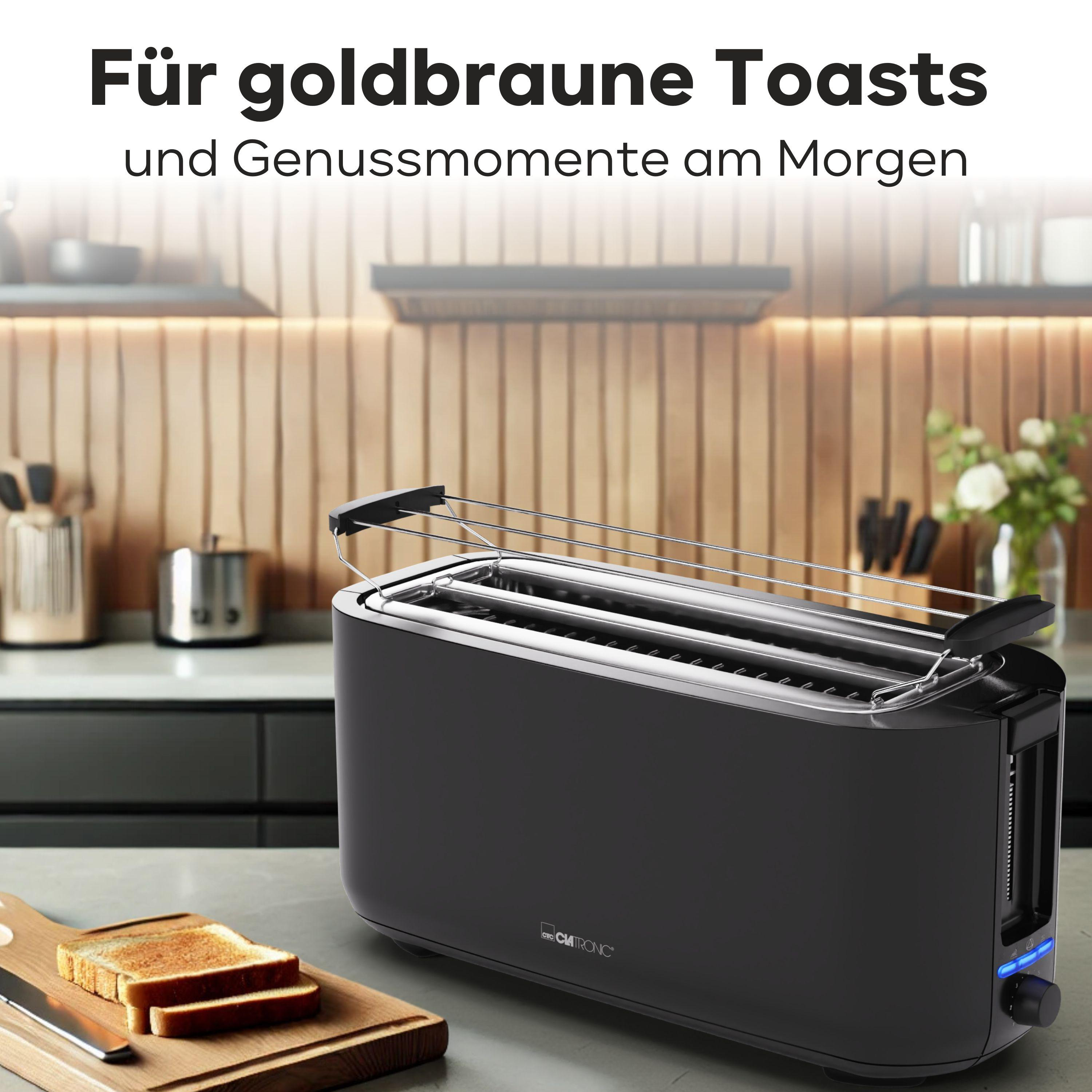 Schwarzer Toaster mit zwei Schlitzen auf Küchentheke, Toast und Holzbrett.