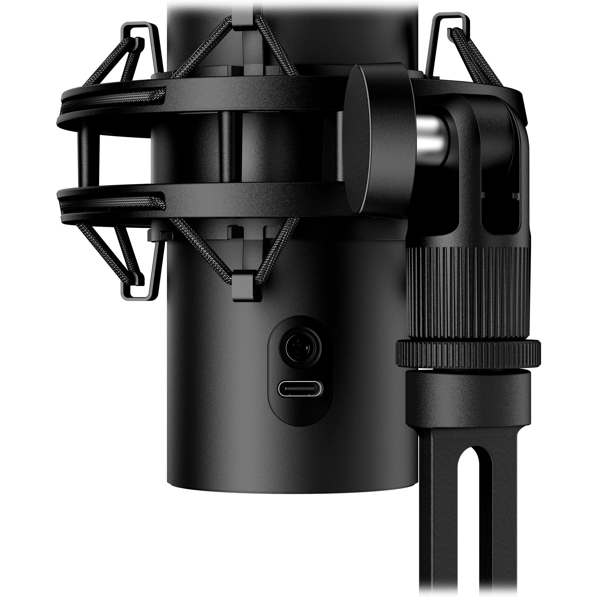 Nahaufnahme eines schwarzen Mikrofons mit Metallkäfig und Ständer. Ein USB-C-Anschluss ist sichtbar.