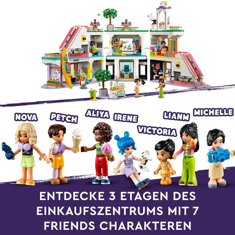 LEGO Friends Set mit Figuren. Sieben Figuren vor buntem Gebäude. Das Gebäude hat mehrere Etagen.
