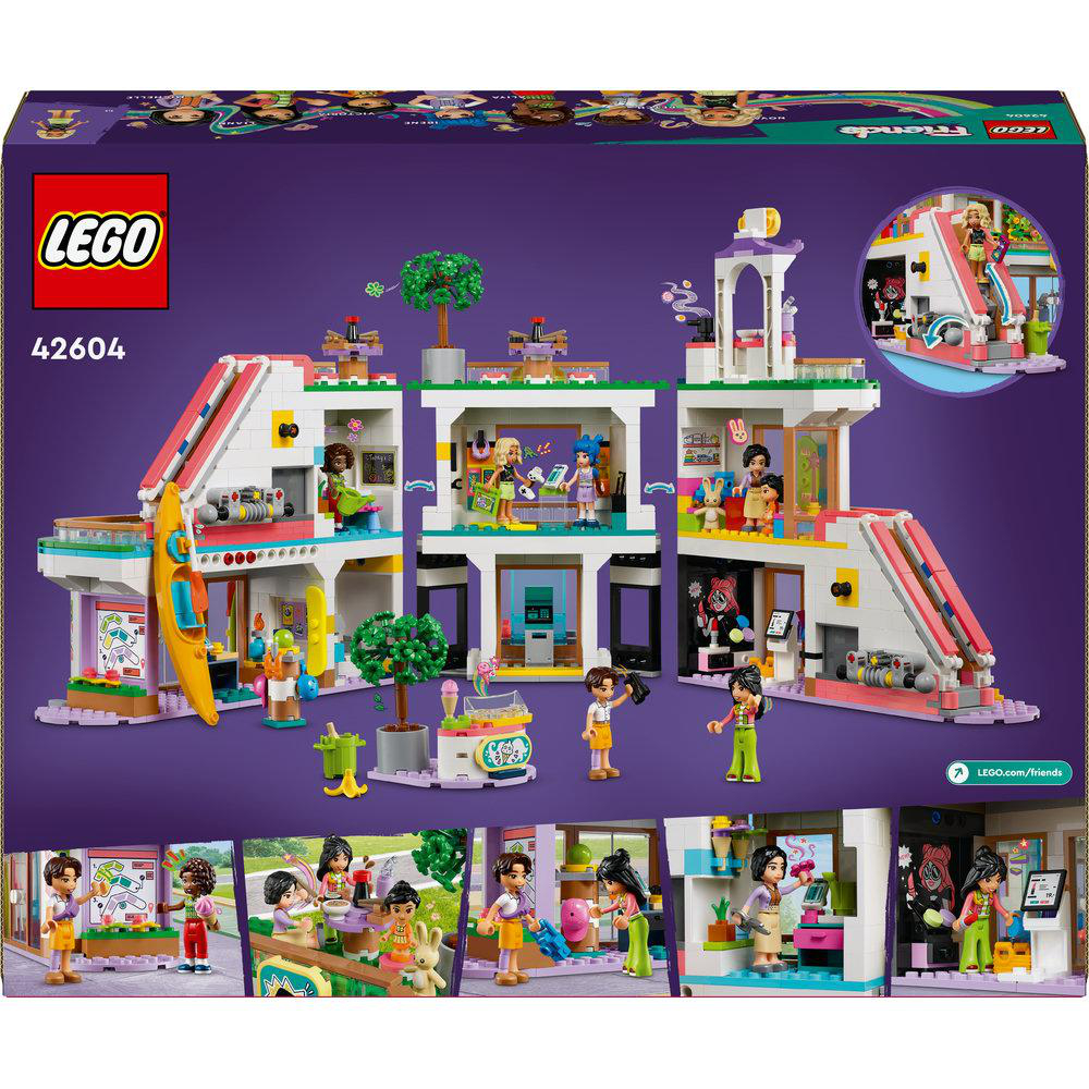 Rückseite einer Lego-Box, die ein komplexes Gebäude mit Mini-Figuren, verschiedenen Räumen und Funktionen zeigt.