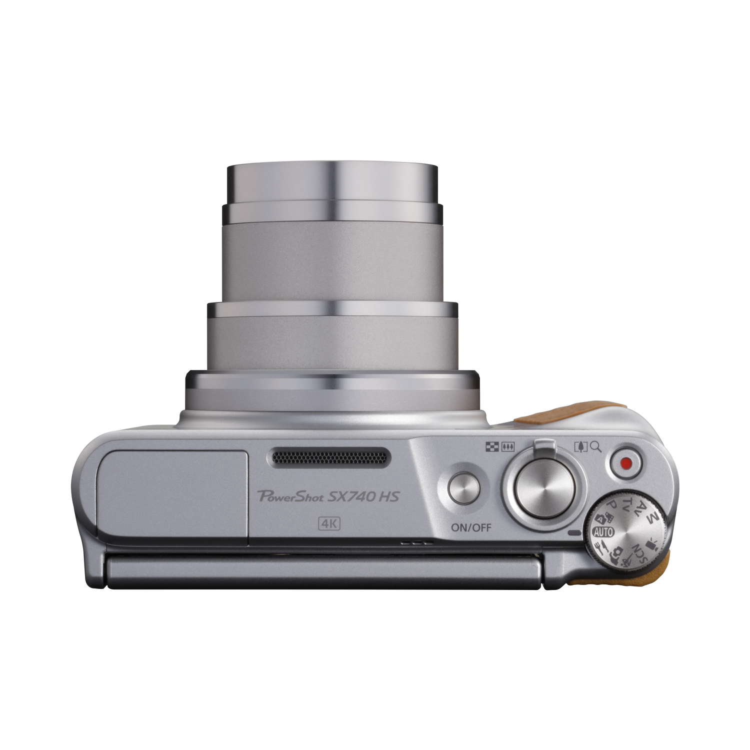A silver Canon PowerShot SX740 HS camera, top view. It has a lens, buttons, and a small brown grip.