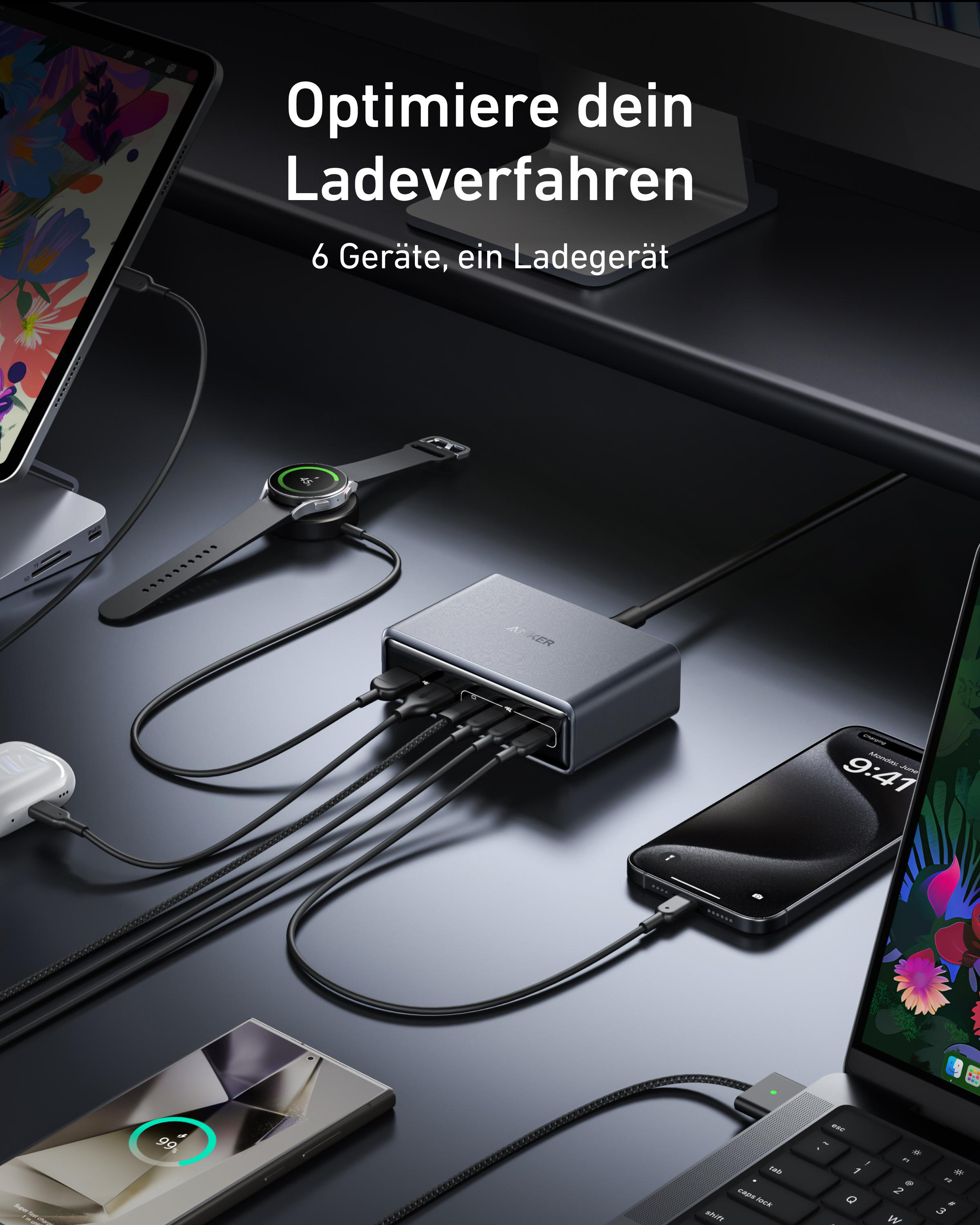 Schwarze Ladestation mit mehreren Kabeln, die an Geräte wie Telefon und Smartwatch angeschlossen sind.