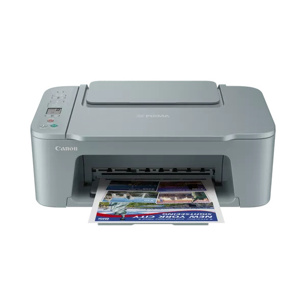 Una impresora Canon Pixma gris está imprimiendo un folleto colorido. La impresora está sobre un fondo negro.