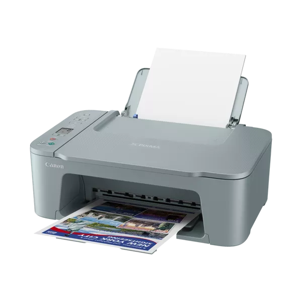 Una impresora Canon gris imprime un folleto turístico colorido de Nueva York. Papel blanco en la bandeja de entrada.