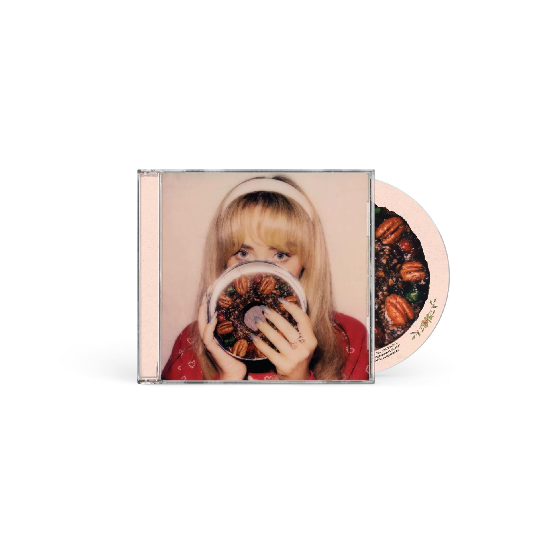CD-Hülle. Eine Frau hält eine CD mit einem Kuchenbild vor ihr Gesicht.