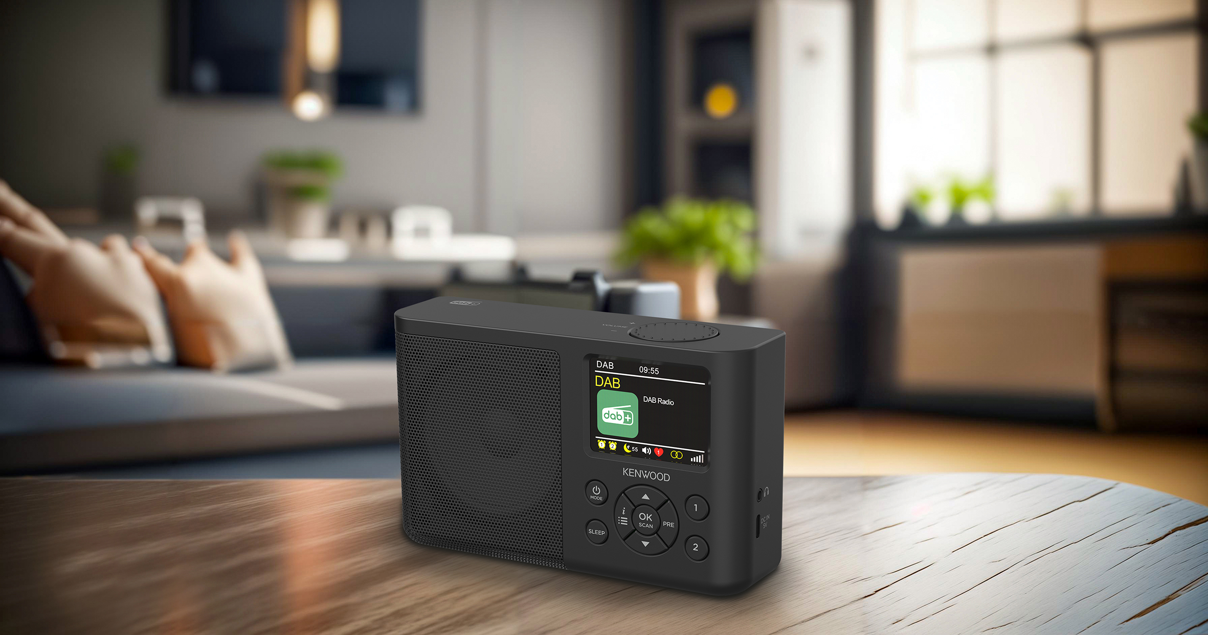 Schwarzes Digitalradio auf einem Holztisch. Es hat ein Display und Steuertasten.