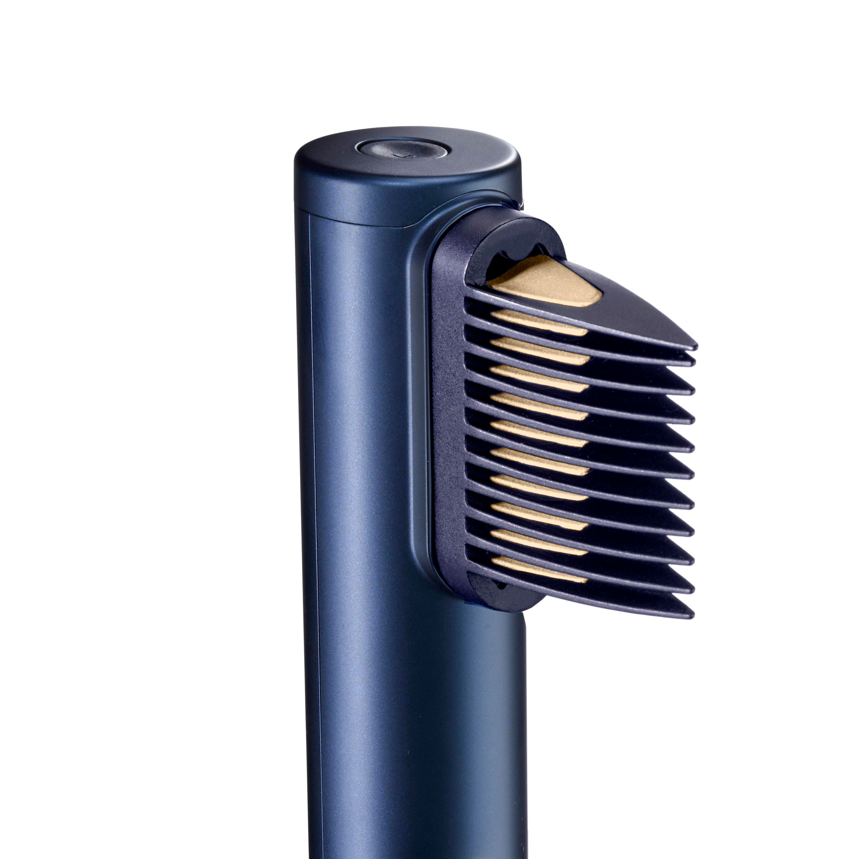Ein dunkelblauer Haarschneider mit einem Klingenaufsatz. Die Klingen sind golden und im Aufsatz sichtbar.