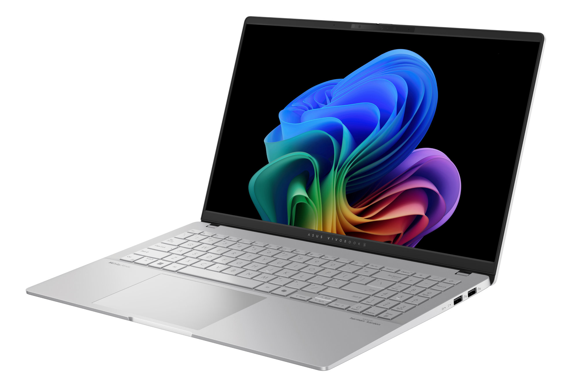 Srebrny laptop z kolorowym wyświetlaczem, pokazującym wirujący wzór, otwarty na białej powierzchni.