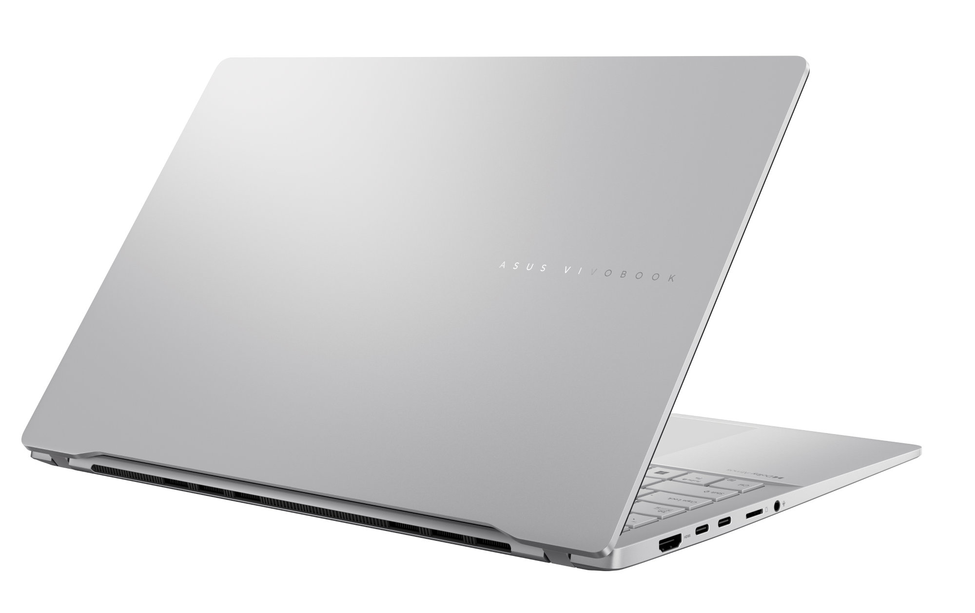 Srebrny laptop, lekko otwarty, pokazujący klawiaturę i logo.