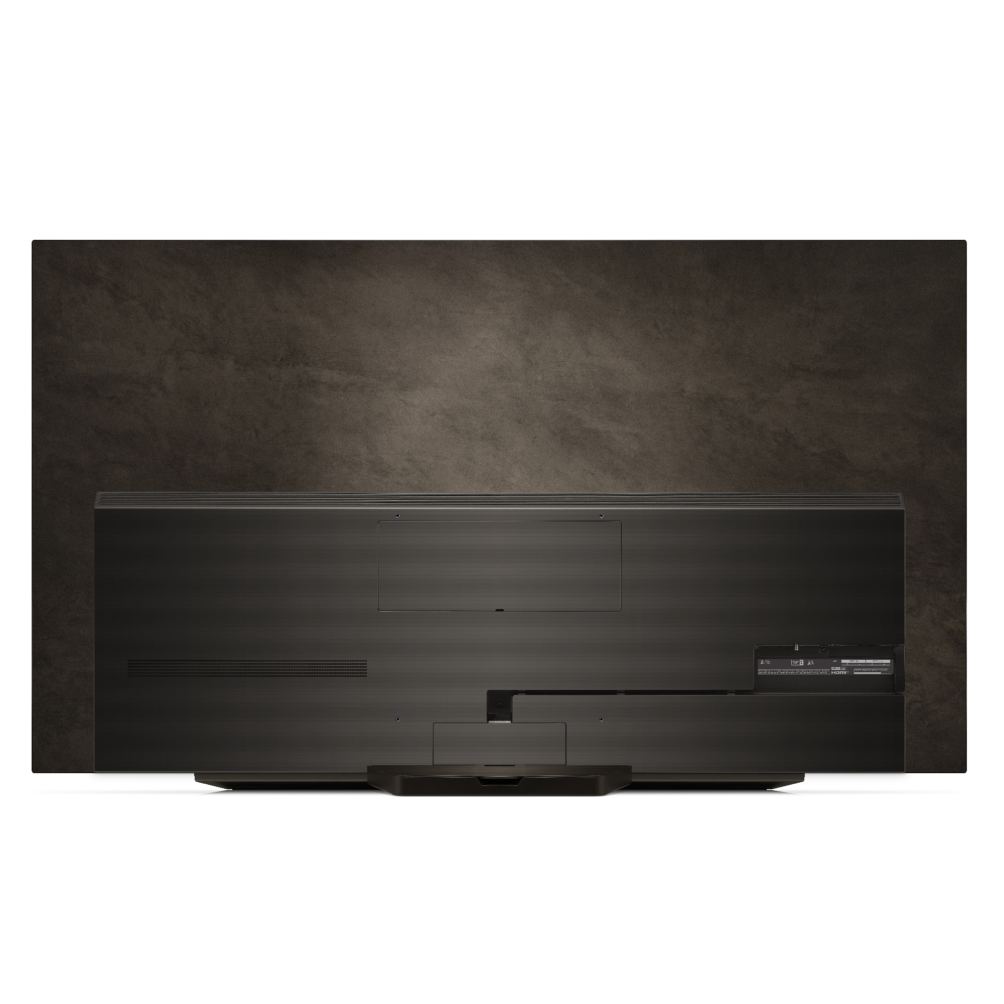 La parte trasera de un televisor negro sobre un fondo texturizado oscuro. El televisor tiene un soporte y puertos visibles.