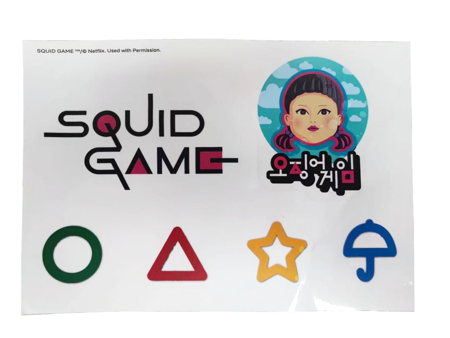 Ein Aufkleberbogen mit Squid Game-Logos, Symbolen und einer Charakterillustration.
