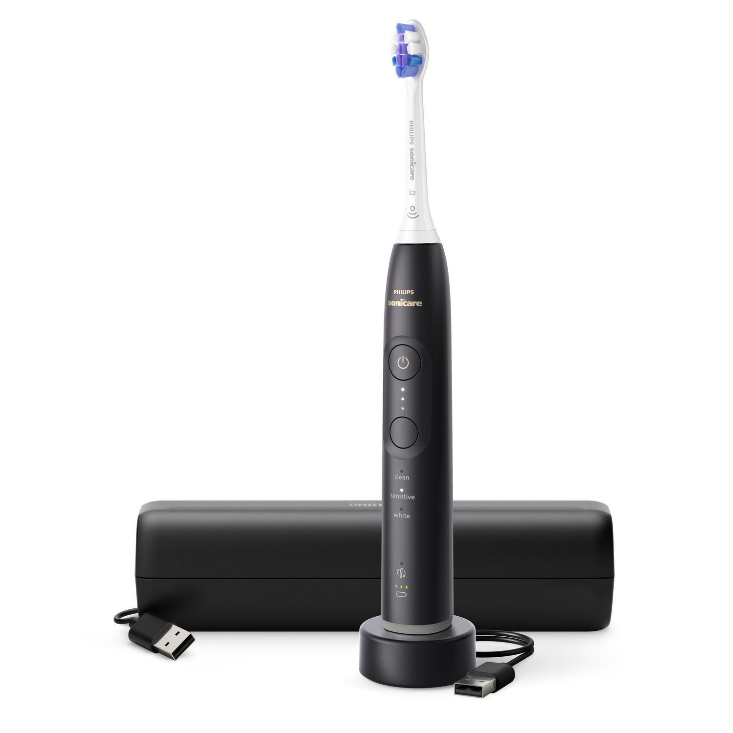 A black electric toothbrush with a charging base and a USB cable.