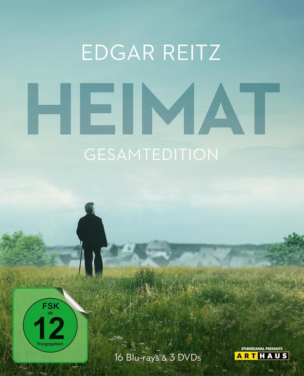 Filmposter: Edgar Reitz, Titel "HEIMAT". Mann auf einem Feld, der mit einem Stock geht. Blu-ray & DVD Set.