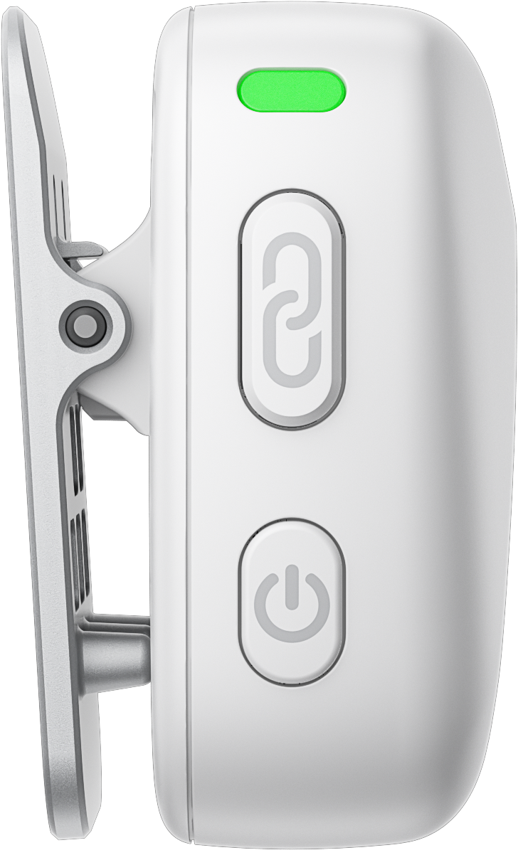 Appareil portable blanc avec boutons et clip. Lumière verte en haut.