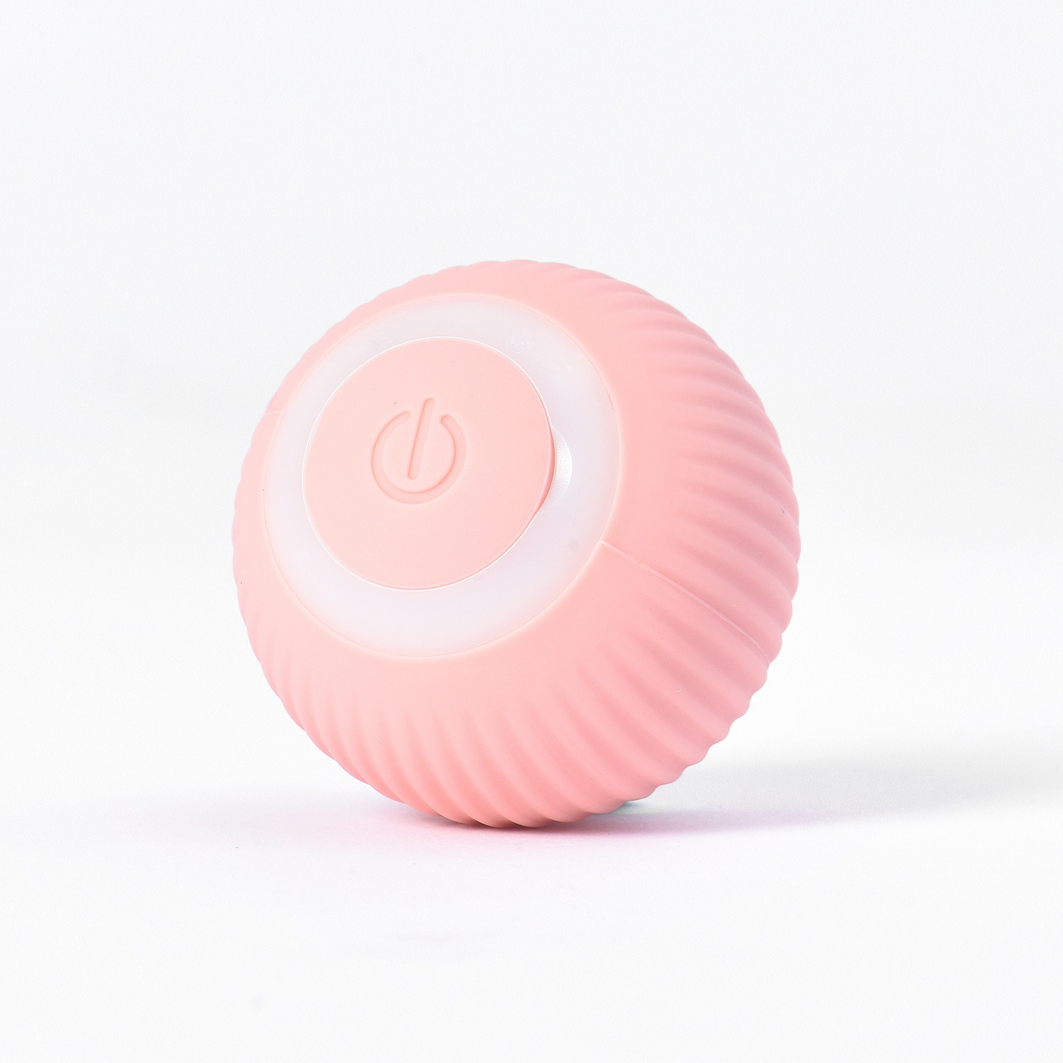 Giocattolo rosa a forma di palla con un anello luminoso e un pulsante di accensione.