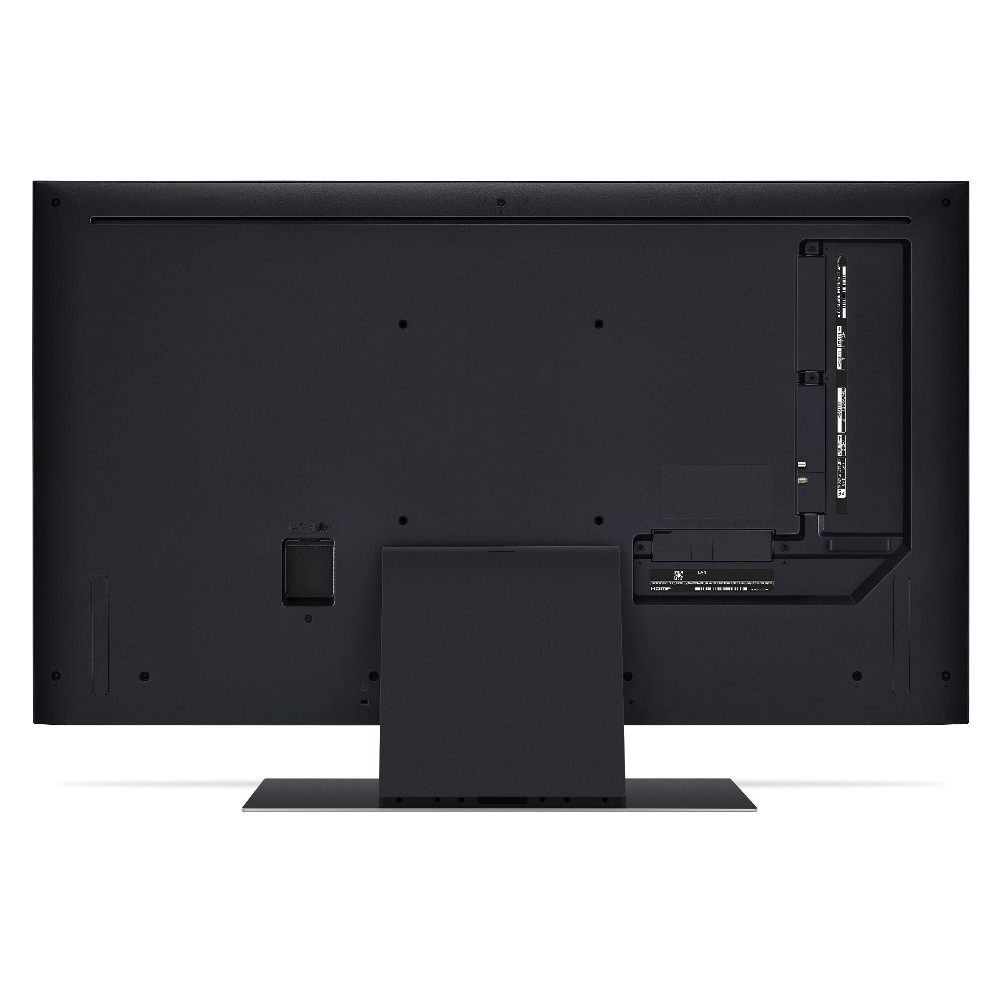 Parte trasera de un televisor LG negro. Muestra los puertos y el soporte en la parte inferior.