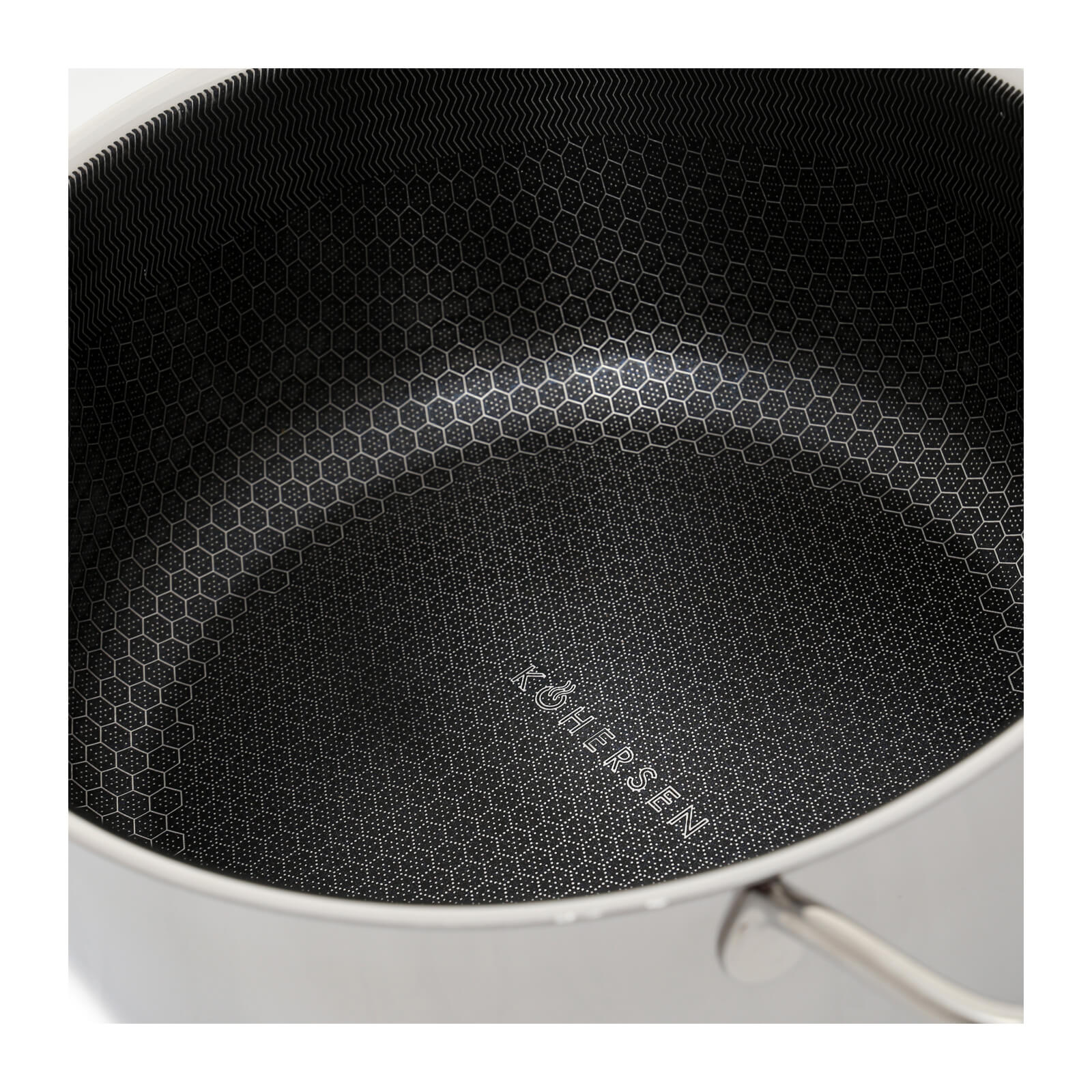 Wnętrze garnka ze stali nierdzewnej z czarnym wzorem plastra miodu.