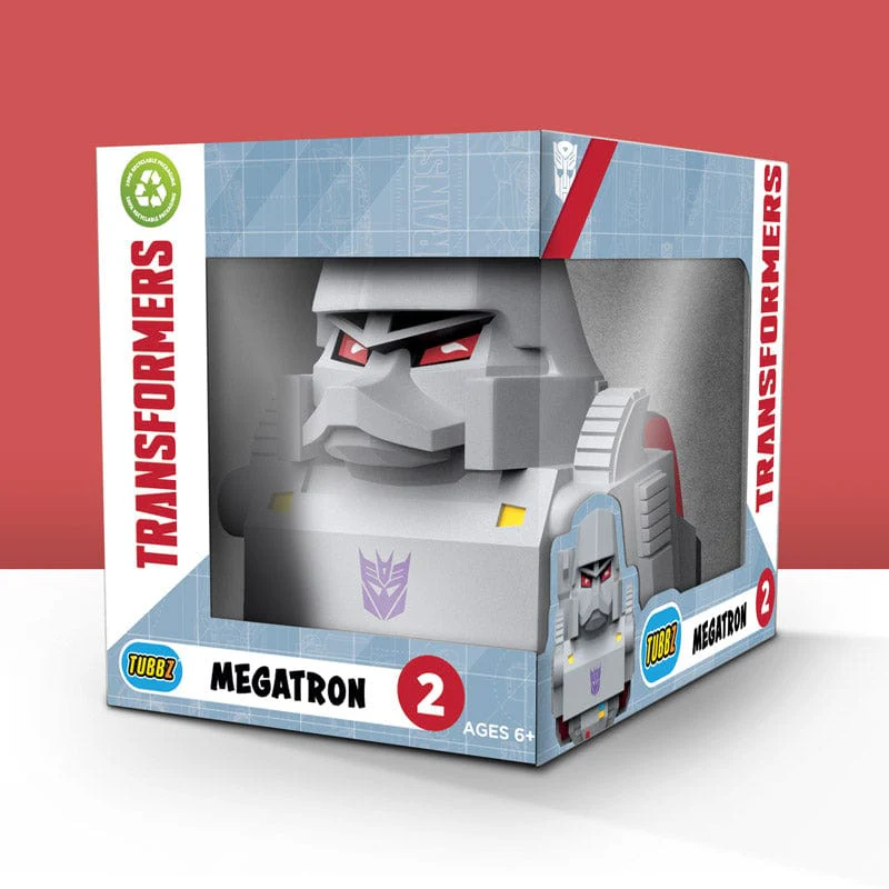Megatron Transformers játék dobozban, piros háttérrel és a Transformers logóval.
