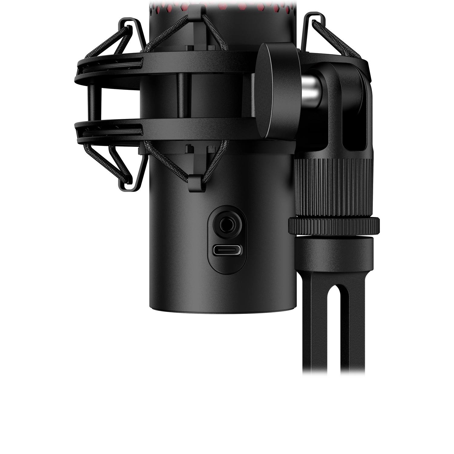 Microphone noir avec corps rond et écran en maille. Sur un support, en gros plan. Port USB visible.