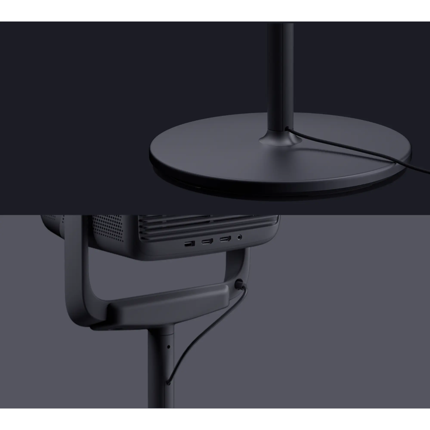 Een close-up van een zwart-grijze staande ventilator, met een geïntegreerd bedieningspaneel en voet.