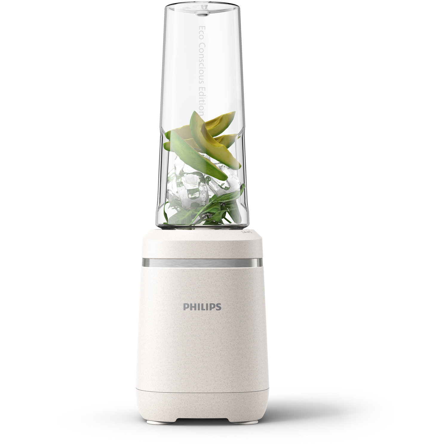 Un blender blanc et beige rempli de glace, de feuilles vertes et de tranches d'avocat.